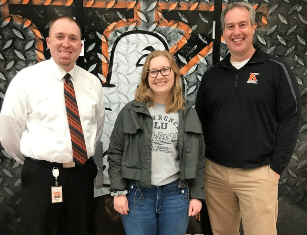 Molly Ruffing in the middle of principal Corey Baumgartner and counselor Matt Binsfeld