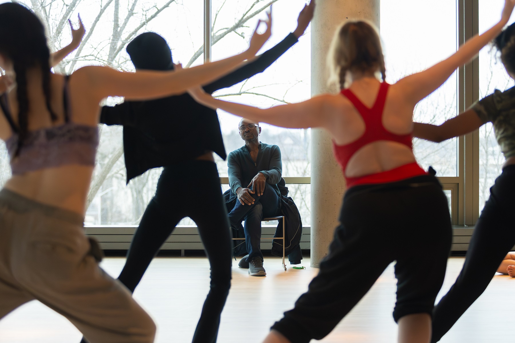 Robert Battle looks on as dancers rehearse in the dance studio in Warch Campus Center.