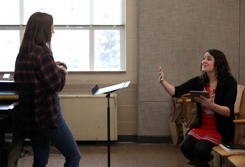 Holly Beemer '22 listens as music professor Estelí Gomez, seated to her right, gives feedback during a studio voice class in the Music-Drama Center. 