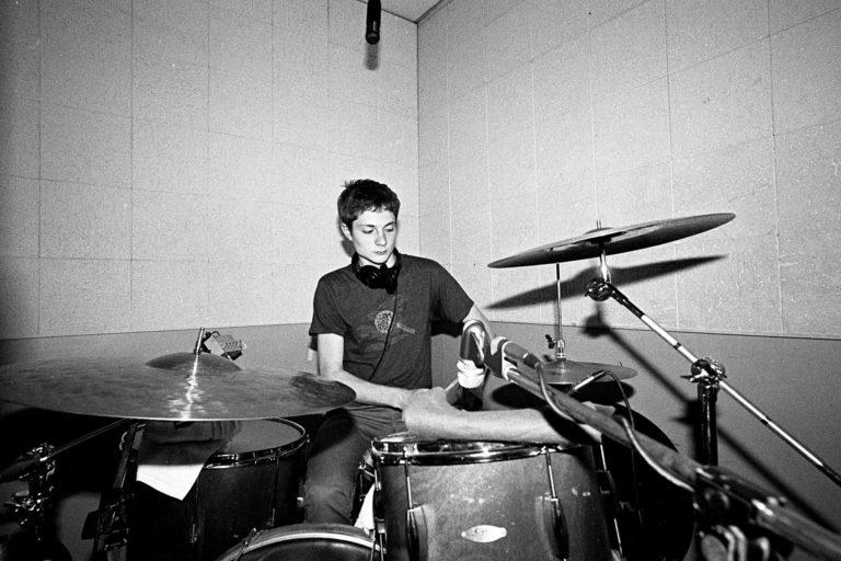 Spencer Tweedy '19 playing drums