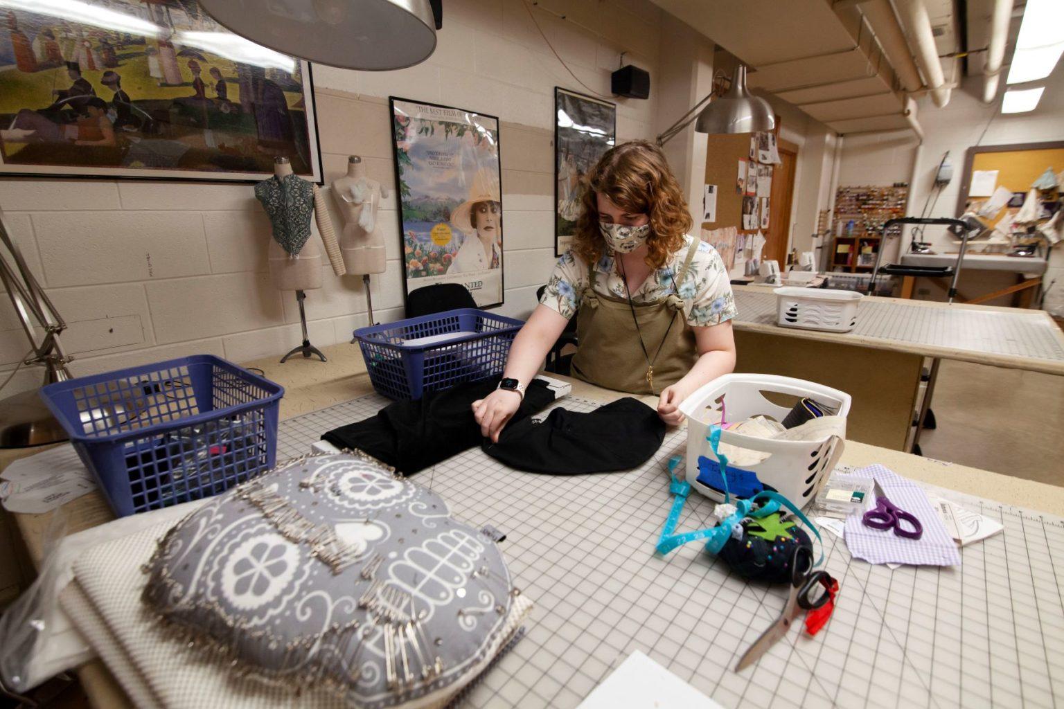 Isabel Kelly ’21 works on a flute mask in the Lawrence University costume shop.