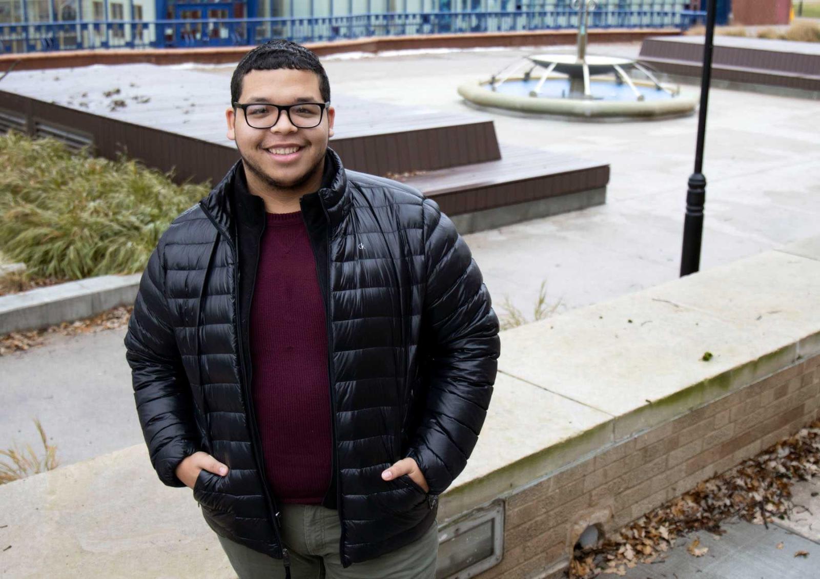 Papo Morales poses for a photo near the Wriston Art Center.