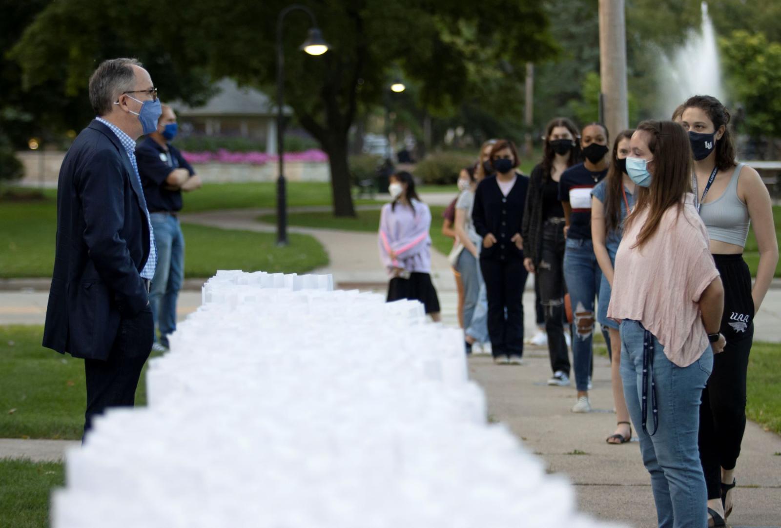 Mark Bürsten and first year students lined up for a reimagined handshake