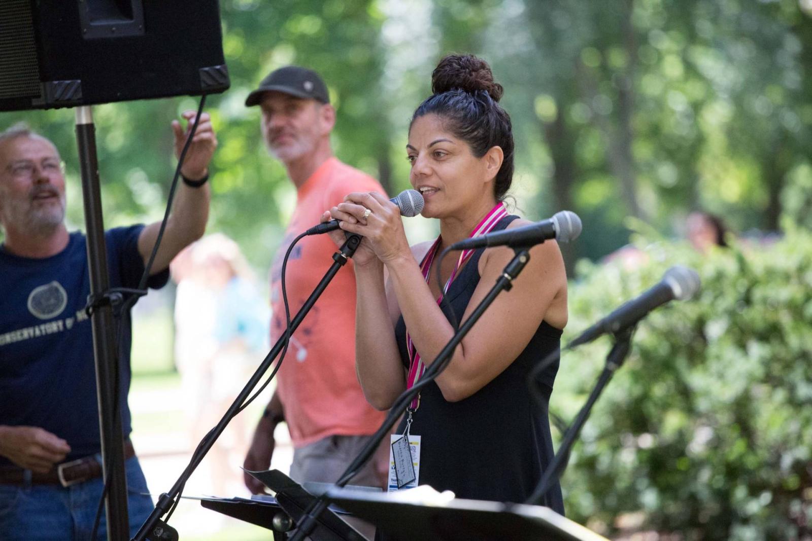 Leila Ramagopal Pertl. music educator from Lawrence University, speaks into a microphone.