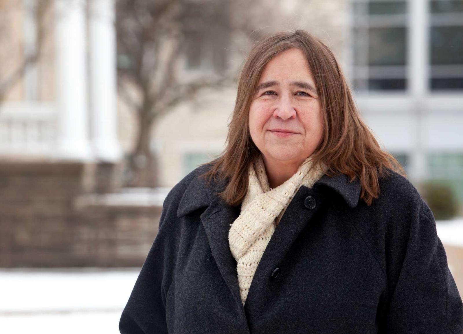 Karen Carr poses for a portrait on Main Hall Green.