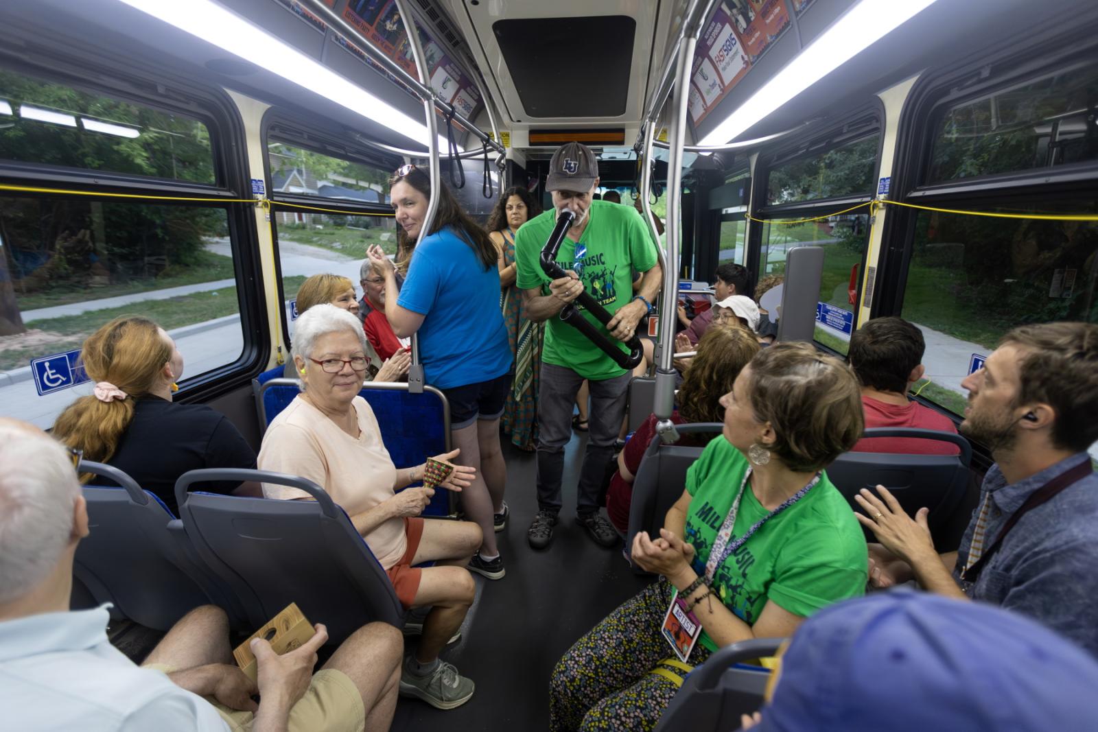 Brian Pertl and other members of the Music Education Team engage with passengers on the Mile of Music Bus.