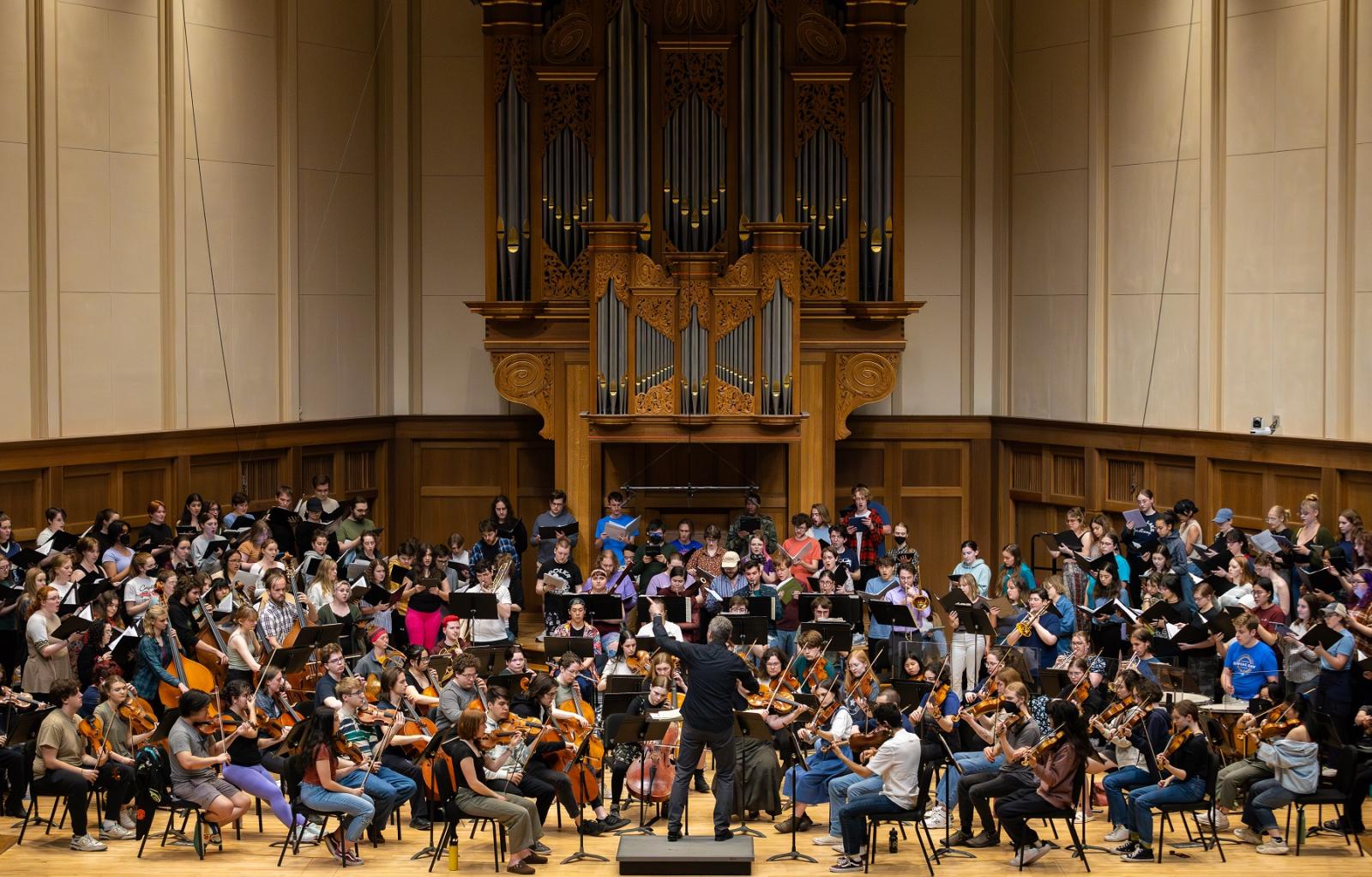 Led by Mark Dupere, Lawrence students rehearse on stage in Memorial Chapel for the April 19 Major Works Concert.