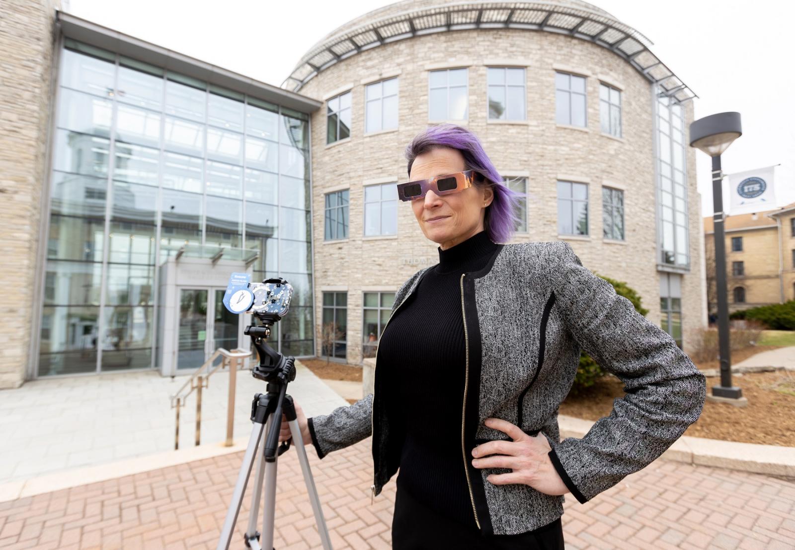 Physics professor Megan Pickett is geared up for Monday's eclipse. (Photo by Danny Damiani)