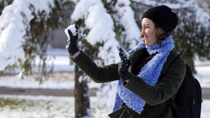 Olivia Sibbet '23 tosses a snowball as she plays in the snow on the Lawrence campus.