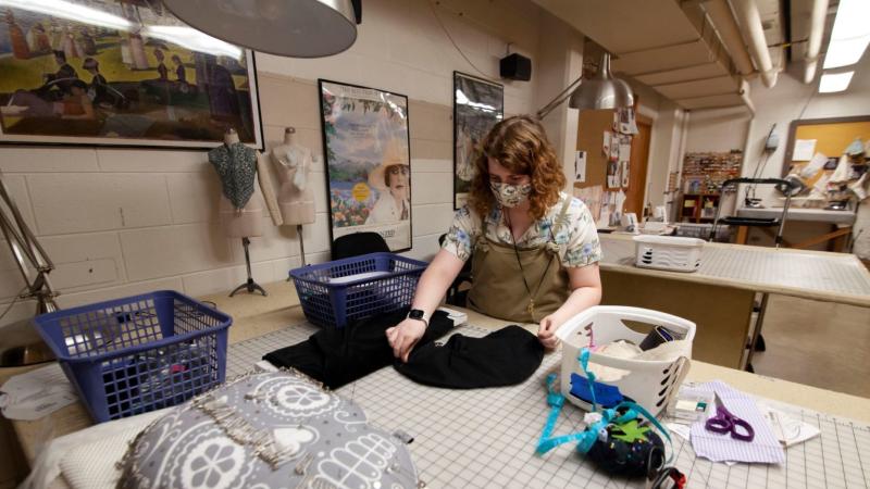 Isabel Kelly ’21 works on a flute mask in the Lawrence University costume shop.