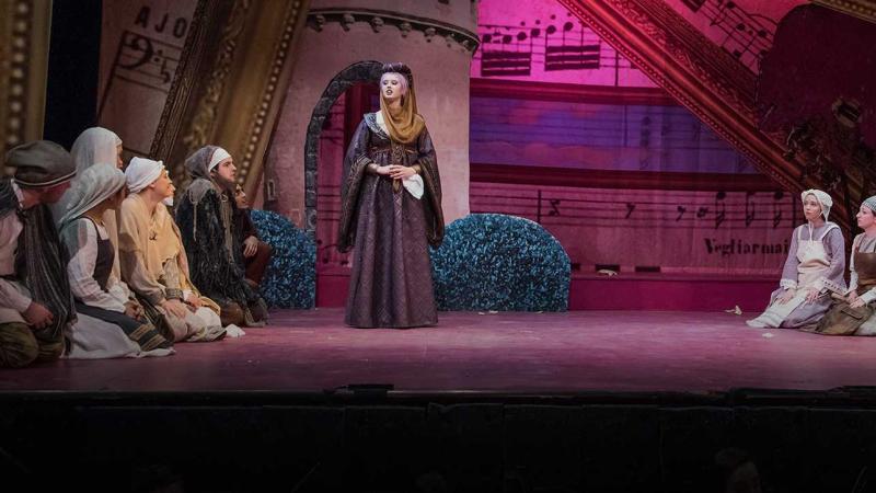 Students perform a stage production