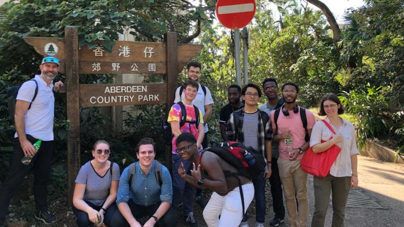 Lawrentians pose around "Aberdeen Country Park" sign in Hong Kong.