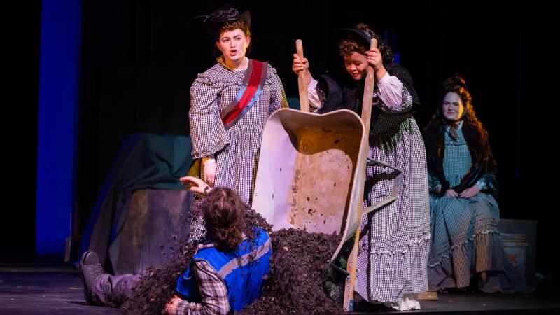 Debris is dumped on Henry Roach by Chelsea Dongas while Anna Milton and Alex Berget look on during opera rehearsal for Alice Tierney.