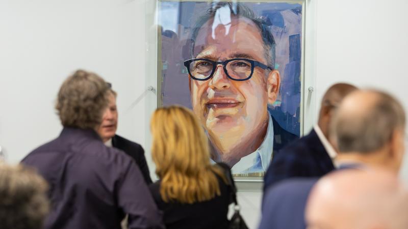 The presidential portrait of Mark Burstein is displayed in the Center for Academic Success in Mudd Library.