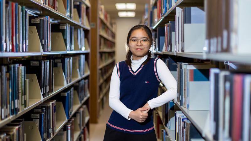 Cailey Cao Le poses for a portrait in Mudd Library.