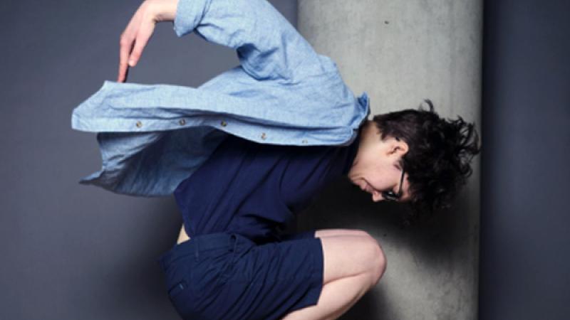 Dance Minor student leaps into air and poses mid-flight