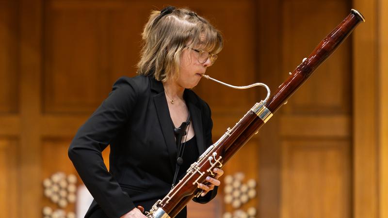 A musician playing bassoon.