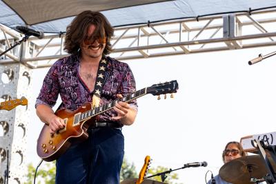 Michael Murphy plays his guitar at Mile of Music.