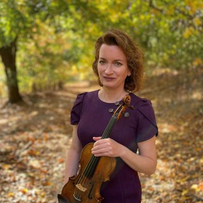Samantha George holding violin.