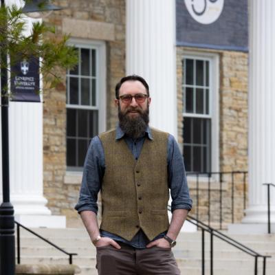 Dr. Kurt Wilson in front of Main Hall