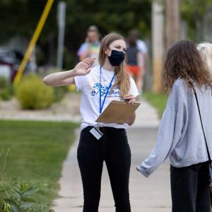 Lawrence staff member helping new student and family find their way around campus.