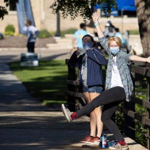 students dance on the Drew Street Bridge during Move-In Day 