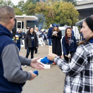 A game of cornhole is played during the tailgate party.