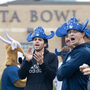 Students cheer at the Banta Bowl during the football game.