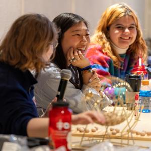 Students share a laugh during Bingo in Warch Campus Center.