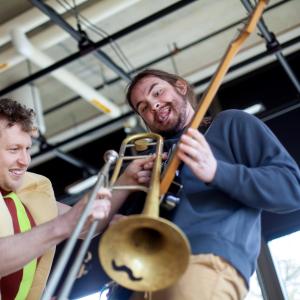Senior Michael Murphy performs with Porky’s Groove Machine during EarthFest at Lawrence.