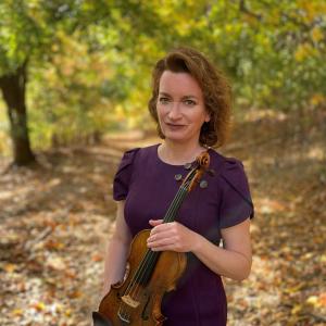 Samantha George holding violin.